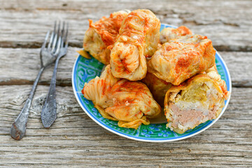 Cabbage rolls with meat, rice and vegetables. Stuffed cabbage leaves with  ground beef. Known as sarma, golubtsy, dolma.
