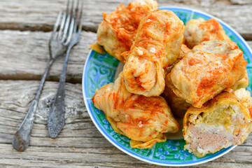 Cabbage rolls with meat, rice and vegetables. Stuffed cabbage leaves with  ground beef. Known as sarma, golubtsy, dolma.
