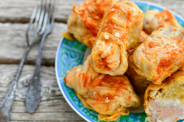 Cabbage rolls with meat, rice and vegetables. Stuffed cabbage leaves with  ground beef. Known as sarma, golubtsy, dolma.