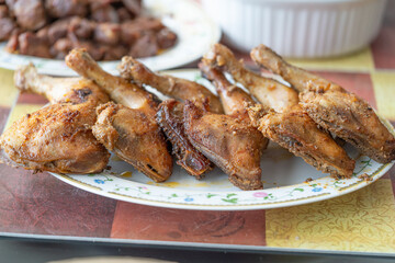 Grilled chicken thighs ready to eat on a buffet