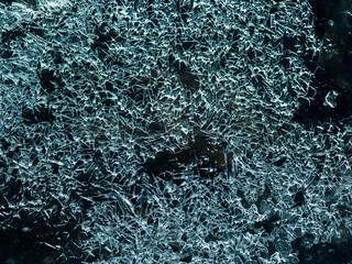 small pieces of ice during a big frost on the glass