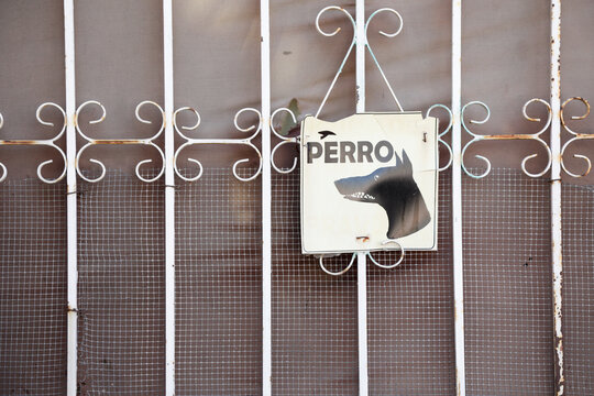 Guard dog sign in Spanish. Cabo San Lucas, Baja California, Mexico