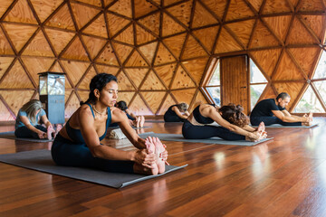 People practicing Seated forward bend