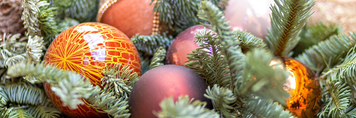 Christmas background of a Christmas tree decorated with Christmas toys. Winter holidays. New Year.