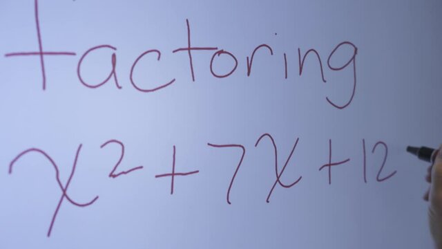 Closeup of marker writing on interactive whiteboard.