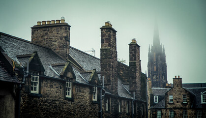 Roofs of old stone houses shrouded in mist