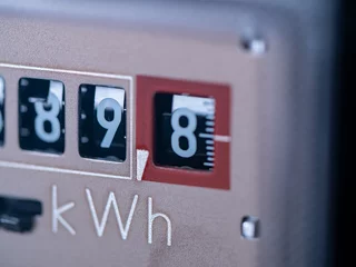 Foto op Aluminium Close-up electricity meter. Measuring used electricity in kWh ( kilowatt hour ) © Westlight