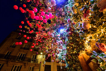 Night in Paris, France. A beautifully decorated florist on Avenue Niel. December 27, 2021.
