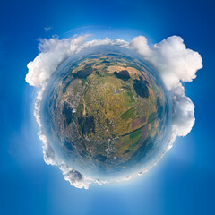 Aerial view from high altitude of little planet earth covered with white puffy cumulus clouds on sunny day - obrazy, fototapety, plakaty