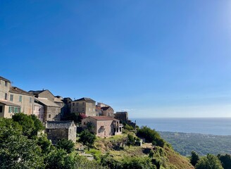 Fototapeta na wymiar Santa Maria Poggio, dreamy village nestled in the mountains of Castagniccia overlooking the Mediterranean Sea. Corsica, France.