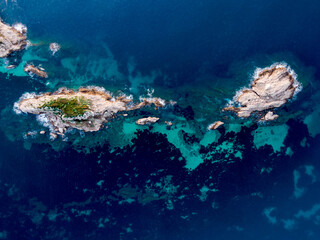 aerial view of coral reef in the blue sea