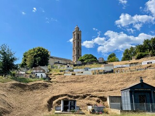 Church Santi Niculaiu and cemetery in San Nicolao, a dreamy village nestled in the mountains of Castagniccia, Corsica, France.