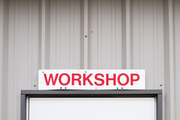 Workshop Sign on Metal Building Get to Work Man 