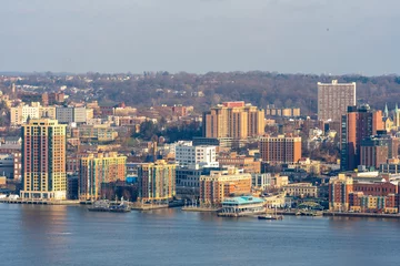 Abwaschbare Fototapete Yonkers, NY / United States - Dec. 24, 2021: a wide landscape view of Yonker's historic waterfront, made up of restaurants, shops and residential buildings. © Brian