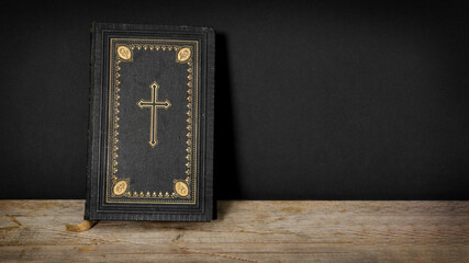 Church faith Christian background - Old holy bible with golden cross on old rustic vintage wooden...