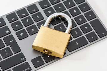 Golden metallic lockpad on the black keyboard.