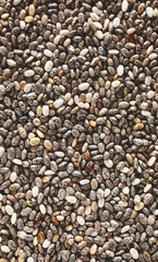 Extreme close up picture of chia seeds, selective focus, natural food background.