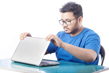 student opening laptop on a table for online education