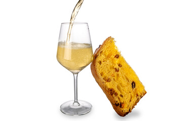 Champagne or sparkling wine splashing into glass with slice of panettone cake, isolated on white....