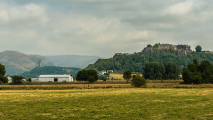 Obraz premium Stirling Castle and Wallace Monument, with the Ochil Hills in background