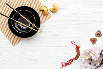 Chinese New Year tabble place setting with golden chopsticks