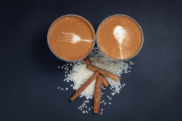 Cinnamon rice pudding on dark background.Top view. Sütlaç