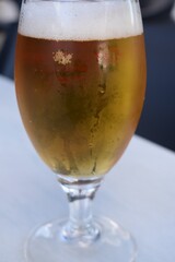 
A glass of fresh beer on the table