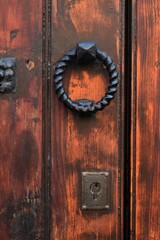 An old wooden door and a metal knob