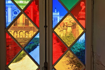 Leadlight window-gravel path-trimmed hedges-tiled niches-walltop busts-glazed doors-S.facing façade. NeoRococo palace-Estoi-Algarve-Portugal-025