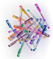 A set of colorful gel pens close-up on a white background