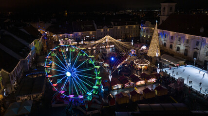 Colored Ferris Wheel at Christmas Market on a calm night