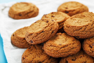 Oatmeal cookies on a napkin on a blue background