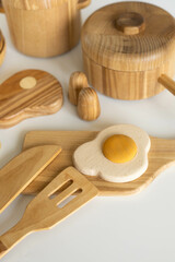 Set of children's wooden eco food. Educational game for girls and boys includes fried eggs, meat and stewpan
