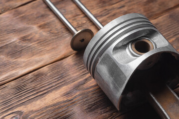 Old car piston and valves close up background with copy space.