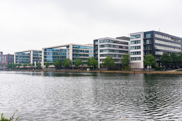 Modern office buildings in a redevelopped area on a former river harbour on a cloudy day. Duisburg, Germany.