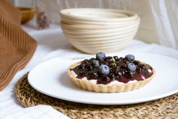 Delicious Blueberry Cheese Pie on white cafe table.
