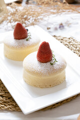 Delicious Japanese fluffy souffle pancakes on white cafe table. - 477509856