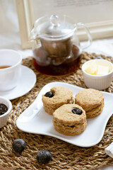 Delicious blueberry Scones on white cafe table.