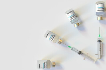 Clock face made with rotavirus vaccine vials and syringes. Vaccination time concept. Conceptual medical 3D rendering