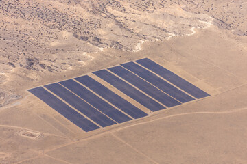 Aerial view of solar energy facility in New Mexico desert.