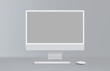 New gray desktop computer display with mouse and keyboard on gray background. Modern blank flat monitor screen. Front view.