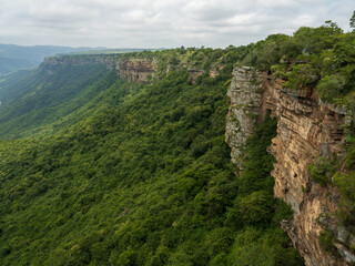 Fototapeta na wymiar Oribi Gorge lush jungle and the east side sand stone rock face