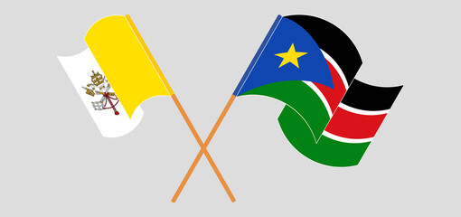 Crossed and waving flags of Vatican and South Sudan