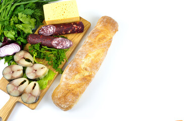 Grocery set on a white isolated background. Fish, sausage, cheese, herbs and bread.