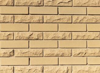Wall of yellow stone. Background and texture