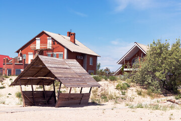 Gazebo on the beach. Behind you can see beautiful houses