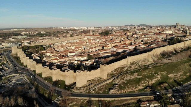 Aerial view of the walled city of Avila, from its soth-west side; Avila's Cathedral at the end