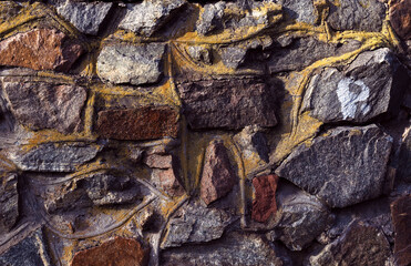 Stone wall. Covered with moss.