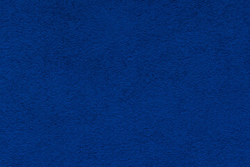 Dark blue background. The stone wall of the building.