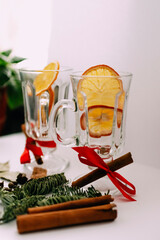 Mugs with ingredients for mulled wine